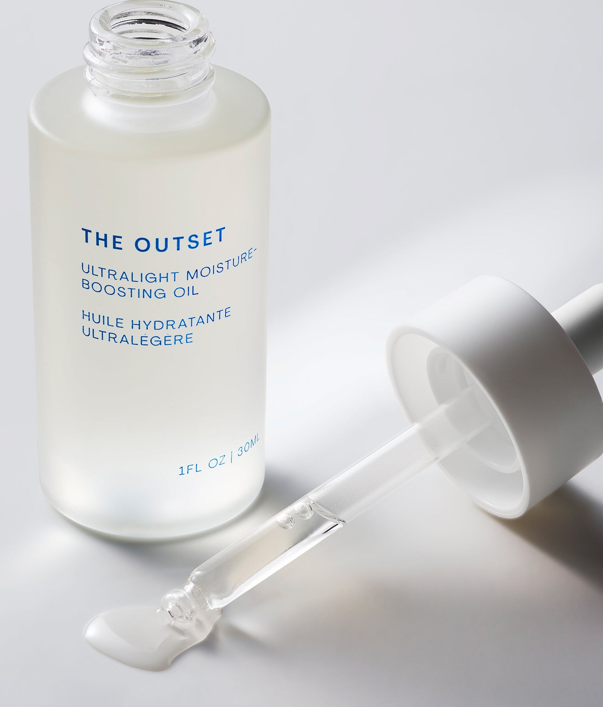 Photo of The Outset's ultralight moisture-boosting oil with dropper and texture